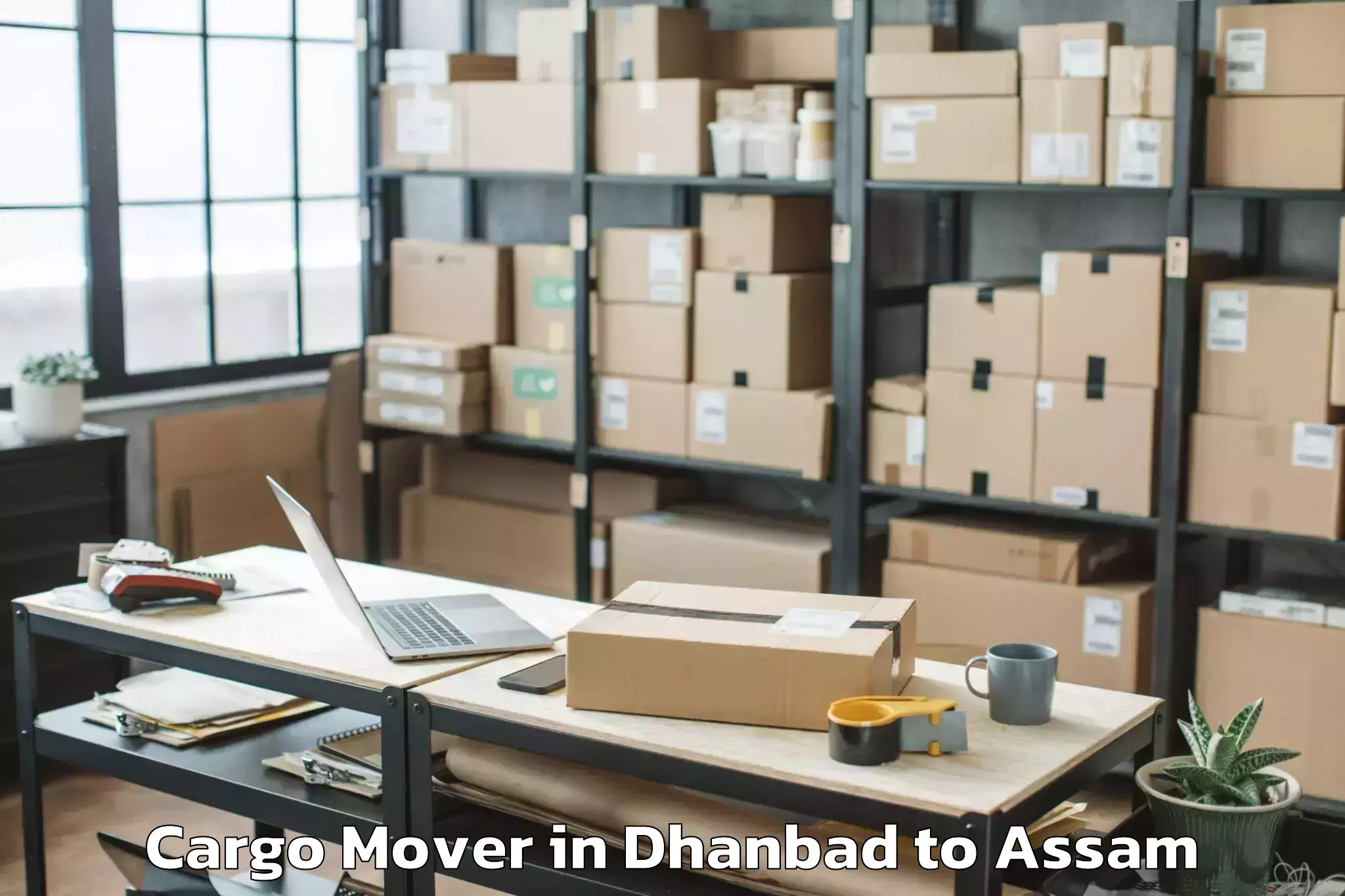 Top Dhanbad to Raha Gaon Cargo Mover Available